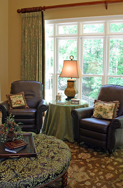 Leather recliners and a large ottoman form a nice triangle of conversation in the living room