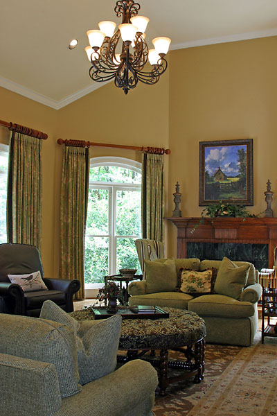 Large, yet Cozy and Warm Living Room with Faux Wood Fireplace