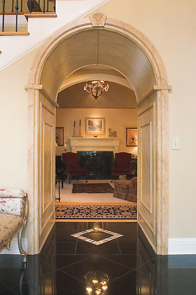 Faux Marble Archway to the Formal Living Room with Custom Tile Inlay in Granite Flooring