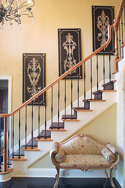 Custom/commissioned art highlights the main staircase and French settee with elegant embroidered silk