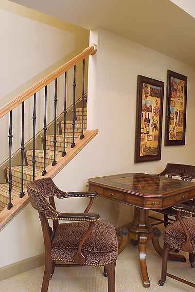 Play chess or checkers at this table in the basement game room, custom staircase runner with leather border.