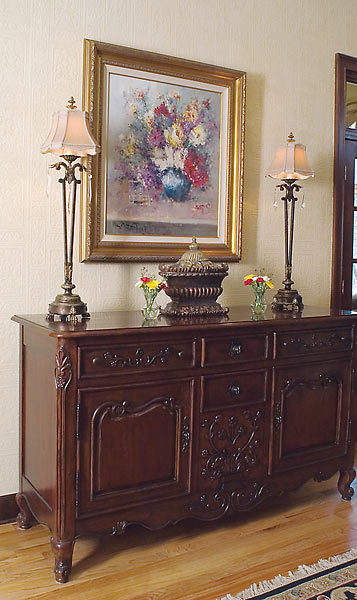 Fine art over this elegant antique buffet chest