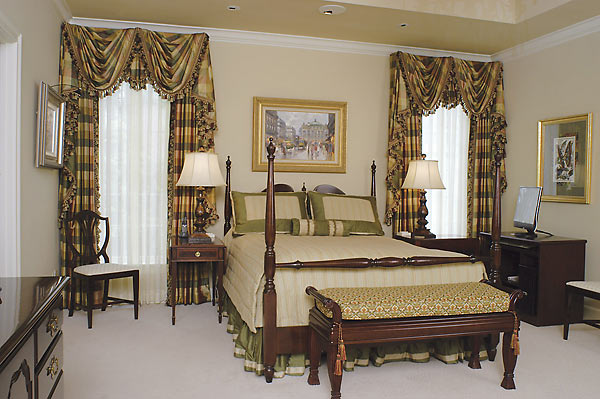 Master bedroom with custom bedding, window treatments, original artwork collection